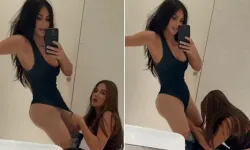 Kim Kardashian, çıtçıtlı body giyerken yardım aldı