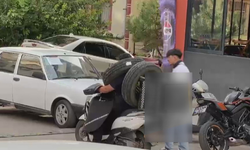 Motosikletle ilginç taşıma yöntemi kamerada