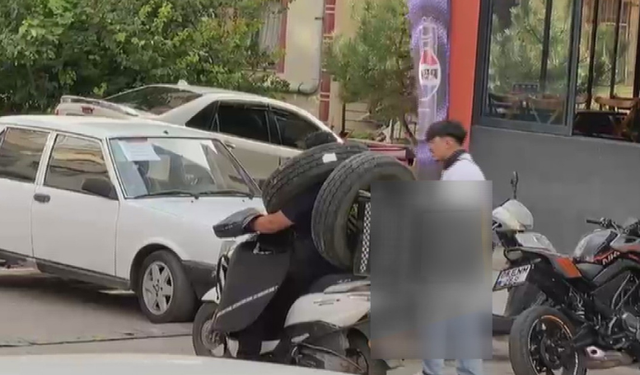 Motosikletle ilginç taşıma yöntemi kamerada